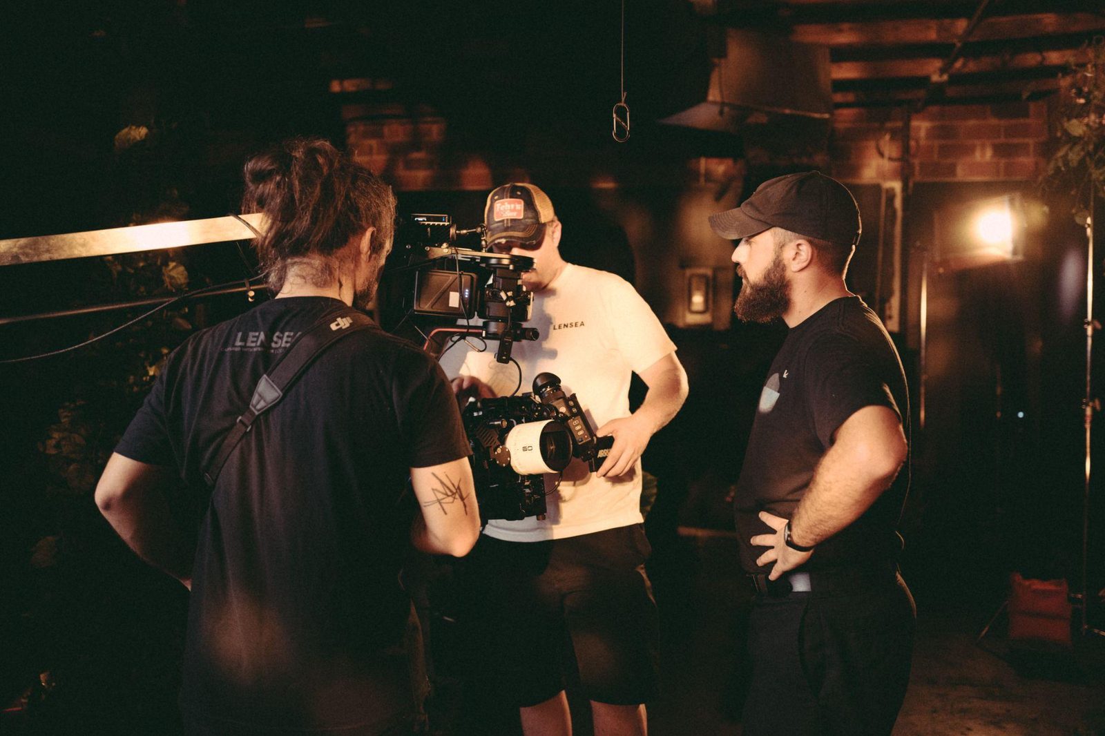 Lensea crew talking through a setup on set